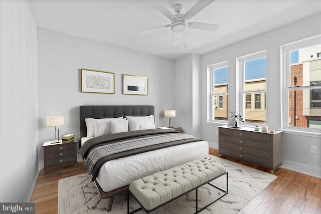 bedroom with hardwood / wood-style flooring and ceiling fan