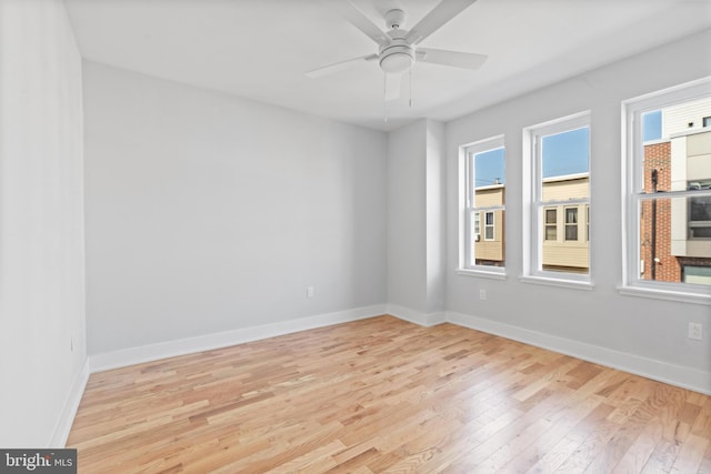 empty room featuring a healthy amount of sunlight and light wood-type flooring