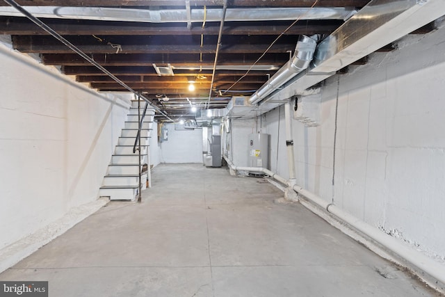 basement featuring water heater and heating unit