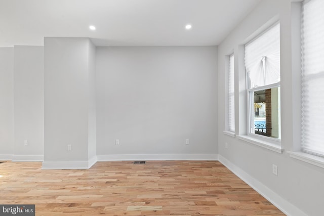 spare room with light hardwood / wood-style flooring