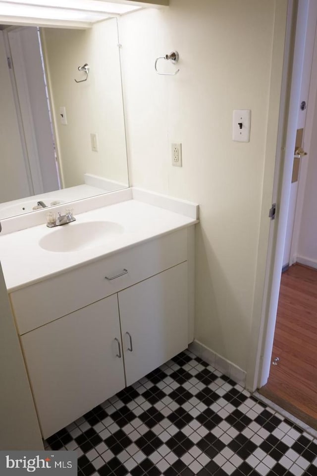 bathroom with tile patterned flooring and vanity