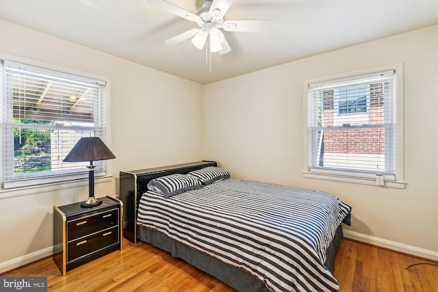 bedroom featuring light hardwood / wood-style flooring and ceiling fan