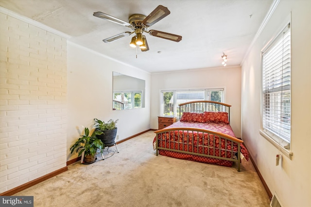 bedroom with light carpet, brick wall, ornamental molding, and baseboards