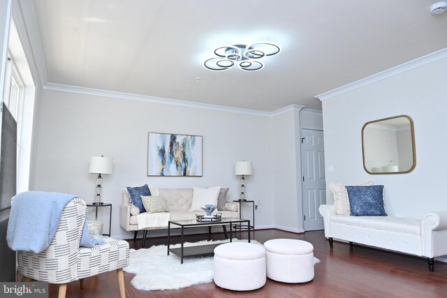 living room featuring baseboards, ornamental molding, and dark wood-type flooring