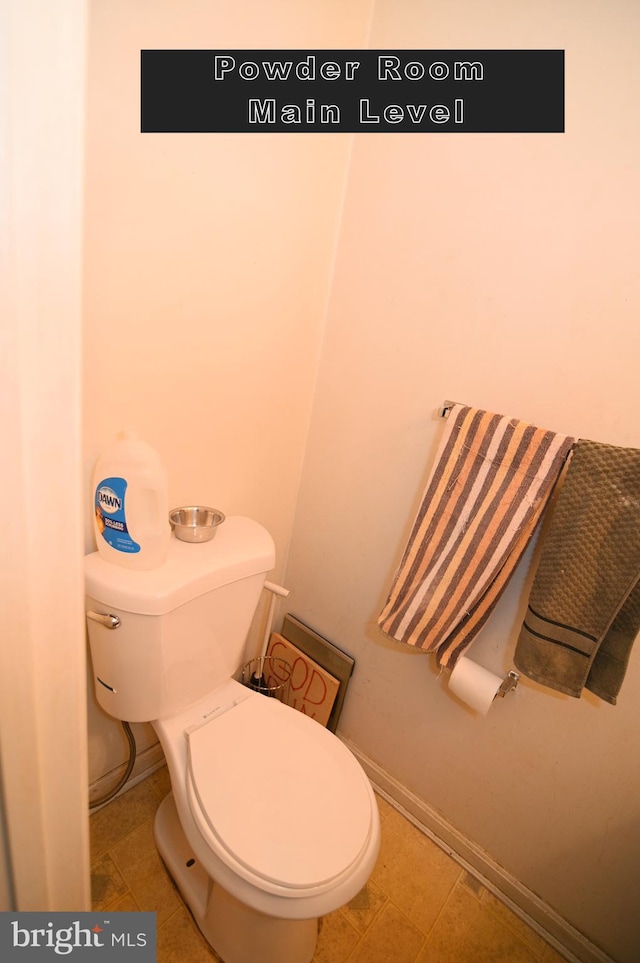 bathroom featuring tile patterned flooring and toilet