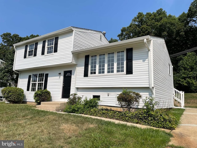 split level home with a front yard