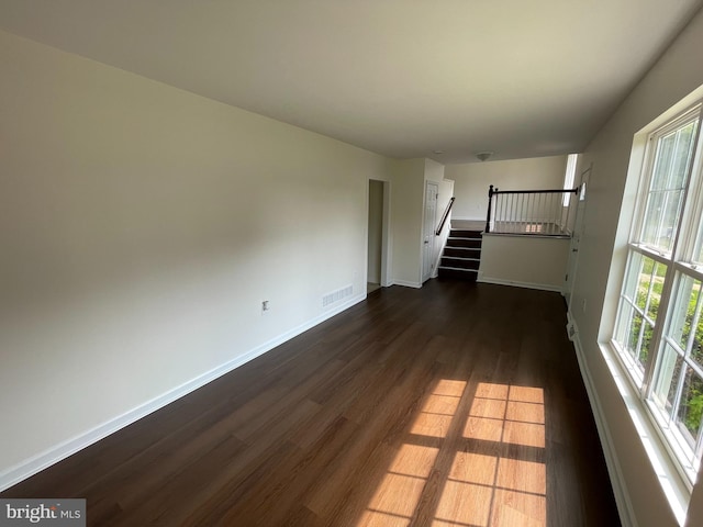 unfurnished living room featuring hardwood / wood-style floors