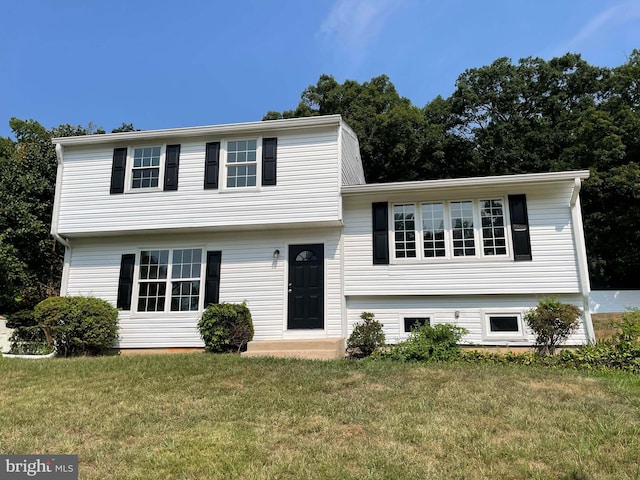 tri-level home featuring a front yard