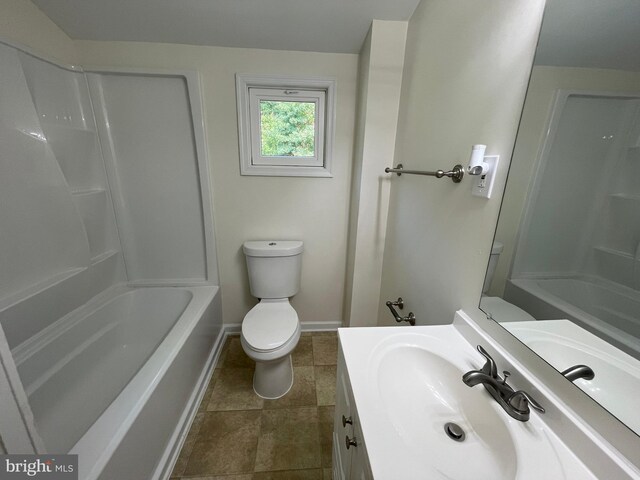 full bathroom featuring tile patterned flooring, washtub / shower combination, vanity, and toilet