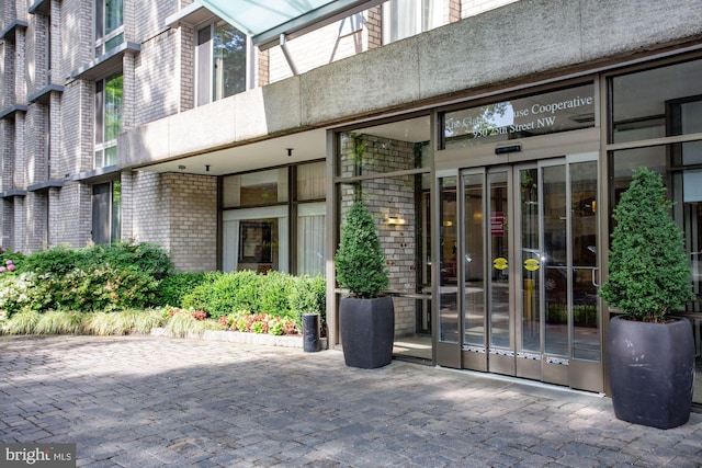 property entrance with brick siding