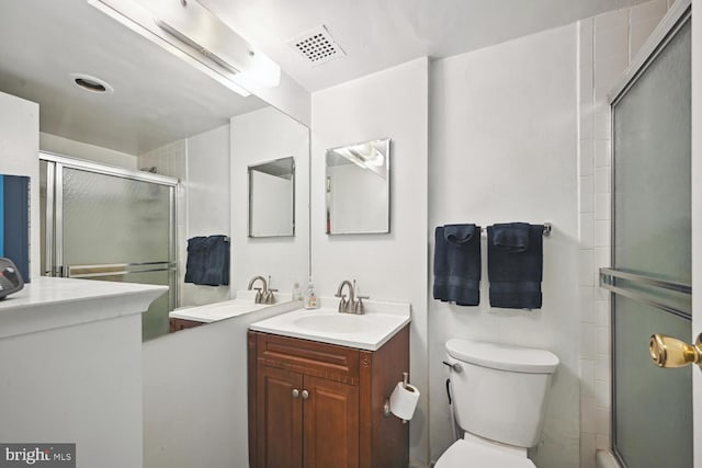 bathroom with vanity, toilet, and walk in shower