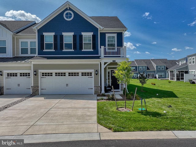 view of front of property featuring concrete driveway, stone siding, a front yard, and a residential view