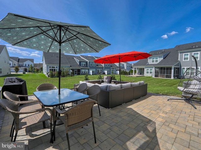 view of patio / terrace with a sunroom and outdoor lounge area