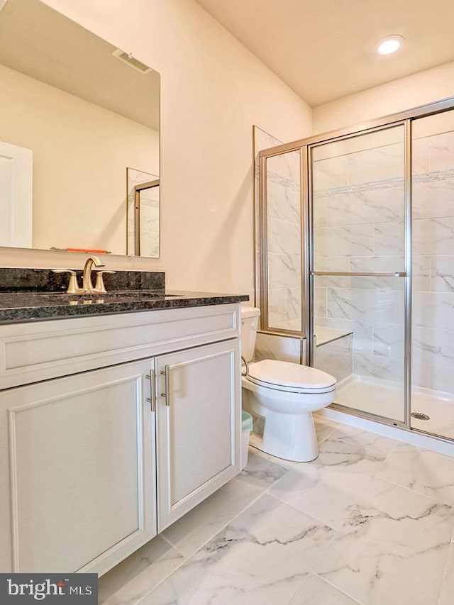 full bathroom with toilet, marble finish floor, a marble finish shower, and vanity