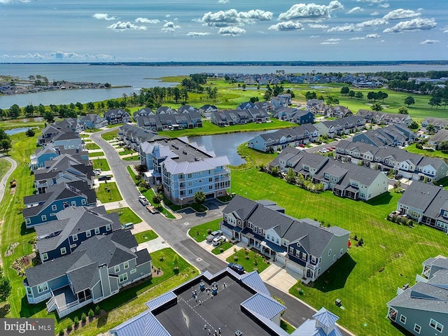 bird's eye view featuring a water view and a residential view