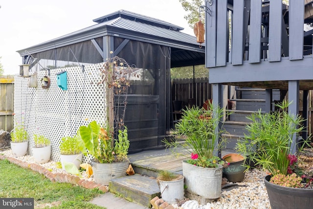 exterior space with fence and a gazebo