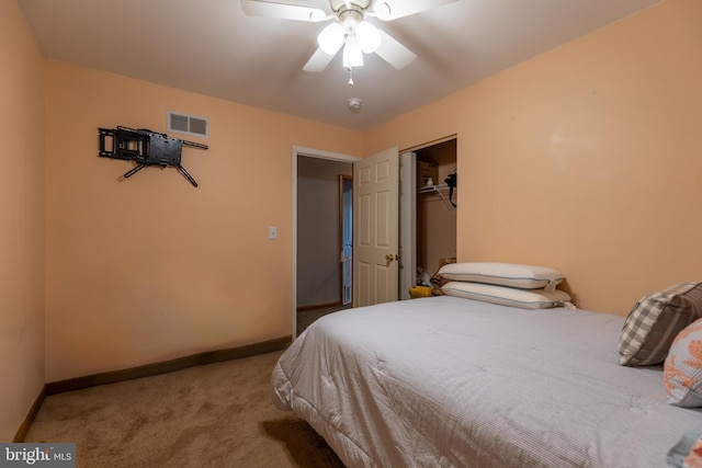 bedroom featuring carpet, ceiling fan, and a closet