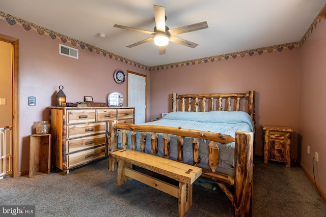 carpeted bedroom featuring a ceiling fan and visible vents