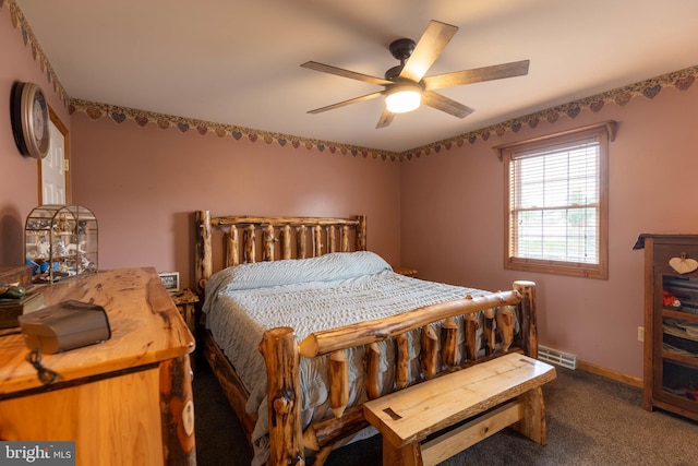 bedroom featuring carpet floors, ceiling fan, visible vents, and baseboards