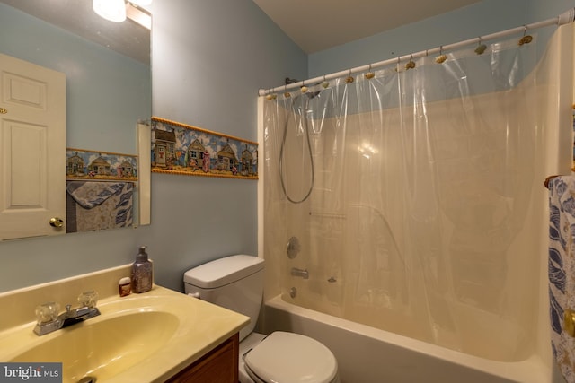 bathroom featuring toilet, shower / bath combo, and vanity