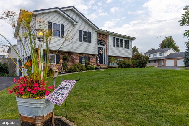 bi-level home with a front yard