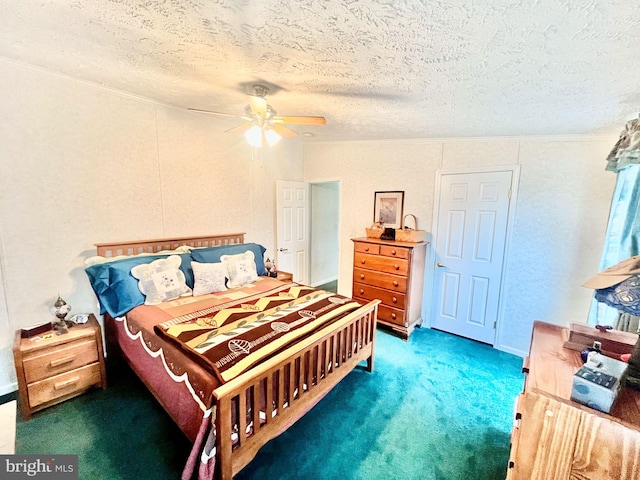 bedroom featuring ceiling fan, dark carpet, and a textured ceiling