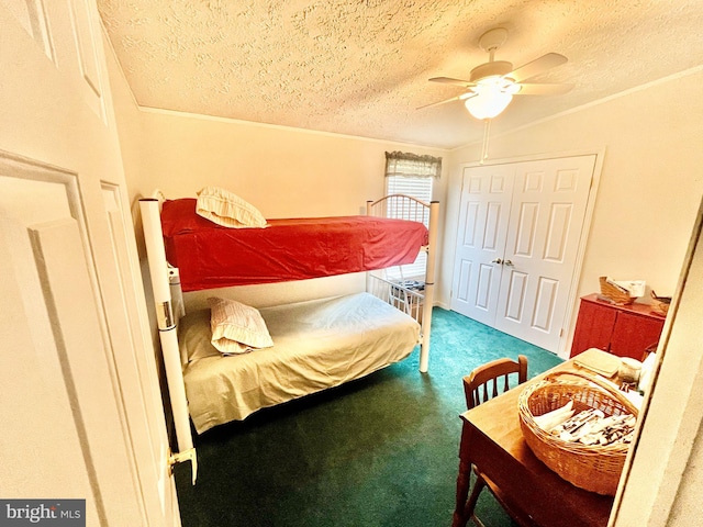 carpeted bedroom with a textured ceiling, a closet, and ceiling fan