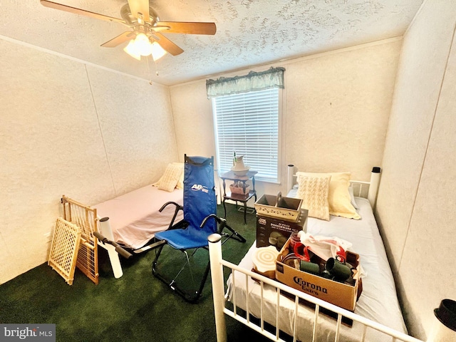 bedroom featuring ceiling fan and a textured ceiling