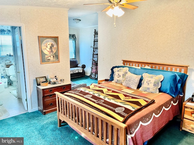 carpeted bedroom with ceiling fan, ornamental molding, a textured ceiling, and ensuite bathroom