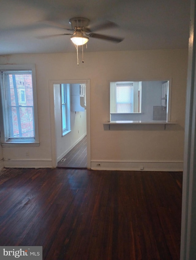 empty room featuring ceiling fan and hardwood / wood-style flooring