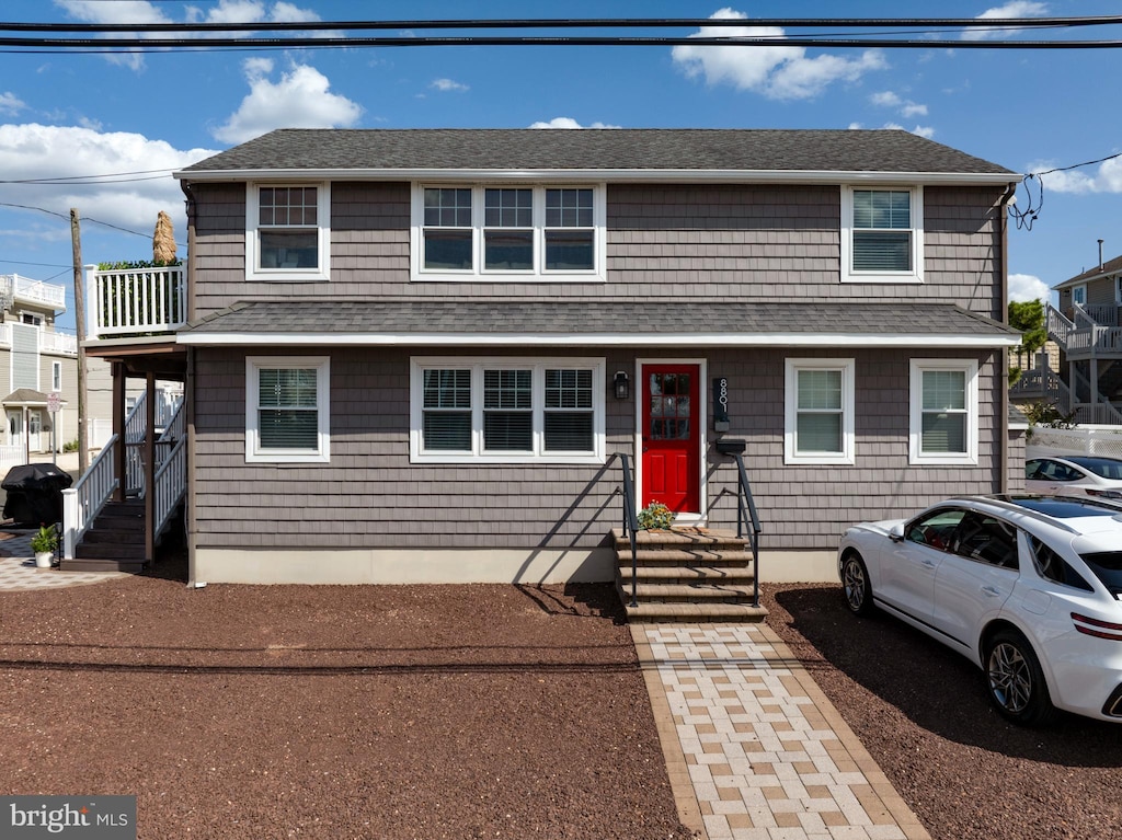 view of front of house with roof with shingles