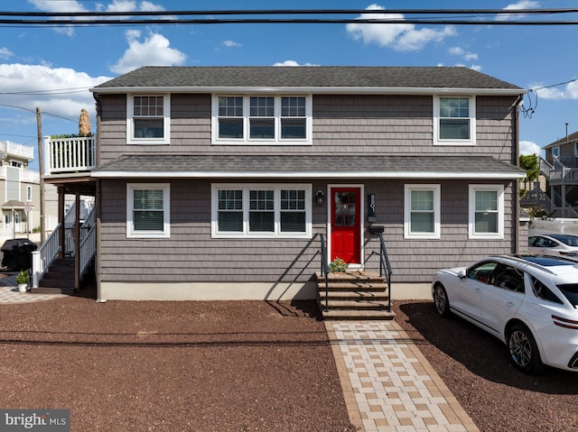 view of front of house with roof with shingles