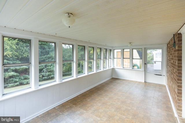 unfurnished sunroom featuring plenty of natural light