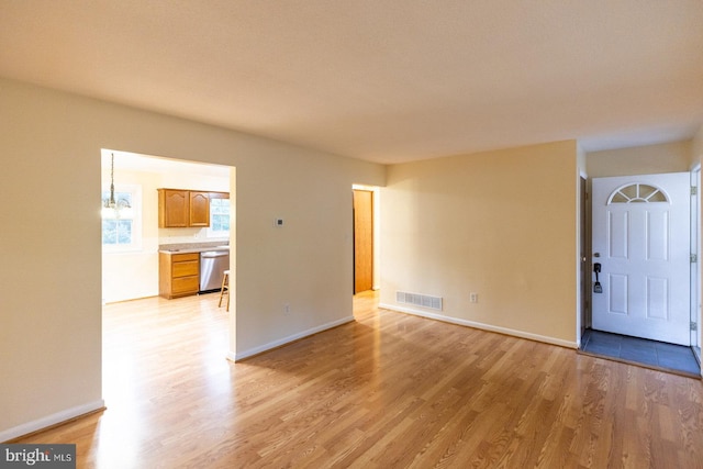 spare room with light wood-type flooring