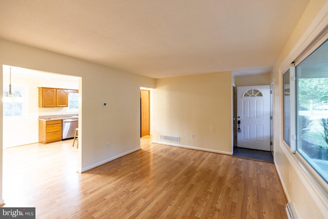 unfurnished living room with light hardwood / wood-style flooring