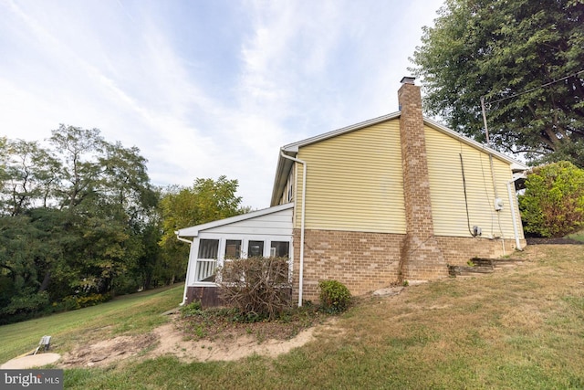 view of home's exterior featuring a lawn