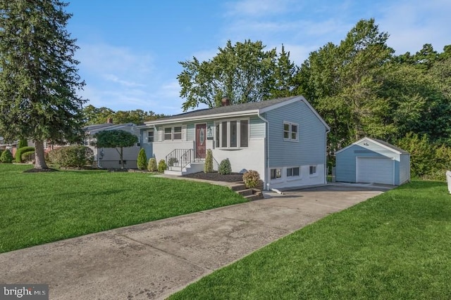 view of front facade featuring a front yard, a garage, and an outbuilding