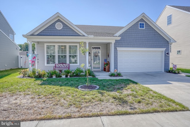 view of front of house with a garage and a front yard