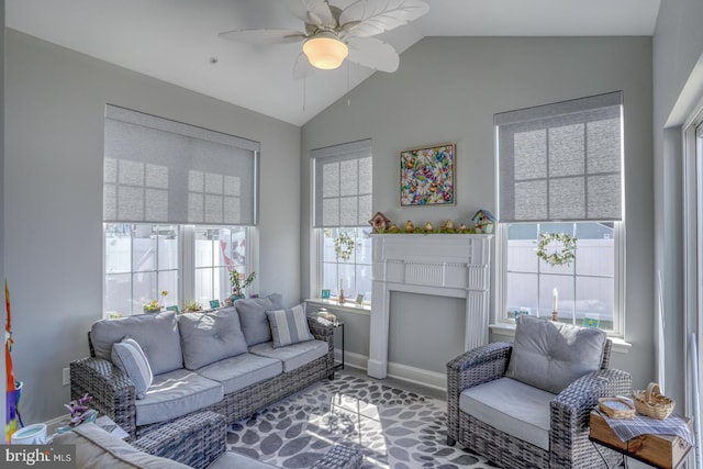 living room featuring ceiling fan and lofted ceiling