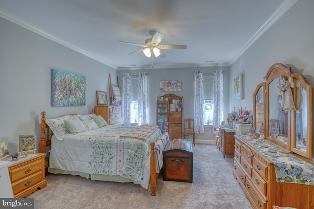 bedroom featuring ornamental molding, light colored carpet, ceiling fan, and baseboards