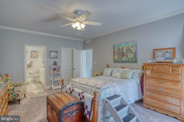 carpeted bedroom featuring ceiling fan, crown molding, and ensuite bathroom