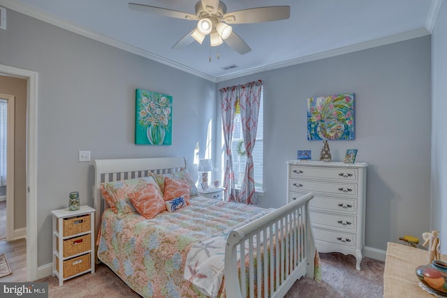 bedroom featuring baseboards, visible vents, light colored carpet, and ornamental molding