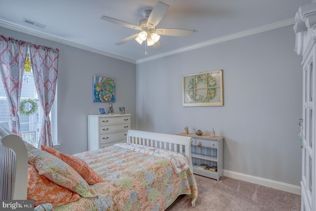 bedroom featuring ceiling fan, ornamental molding, and carpet floors