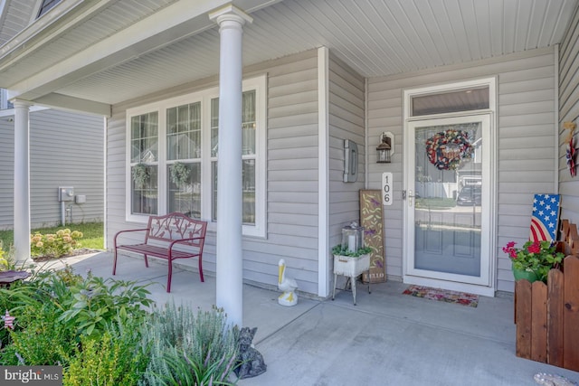 doorway to property with a porch