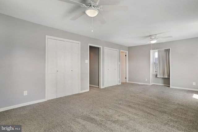 unfurnished bedroom with carpet floors, ceiling fan, and baseboards