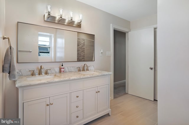 full bath featuring double vanity and a sink