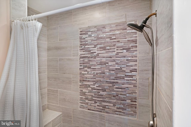 full bath featuring a tile shower