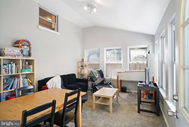 sitting room with lofted ceiling and carpet flooring