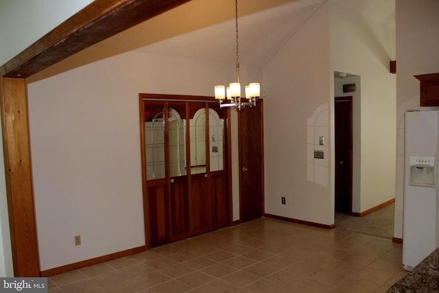 unfurnished dining area with light tile patterned flooring, a notable chandelier, and lofted ceiling