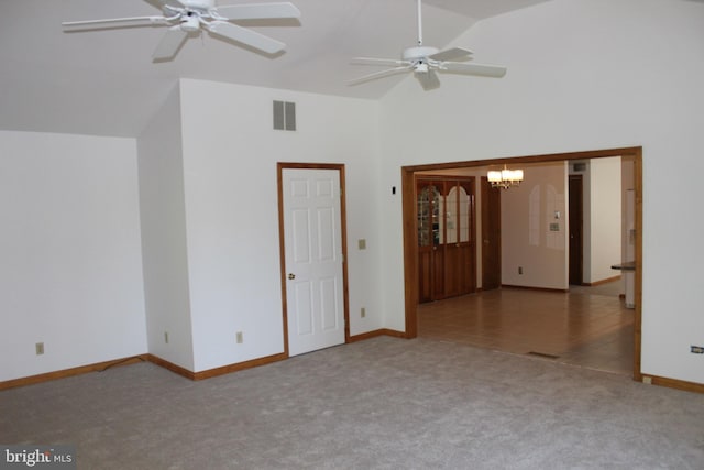 interior space featuring ceiling fan with notable chandelier and high vaulted ceiling